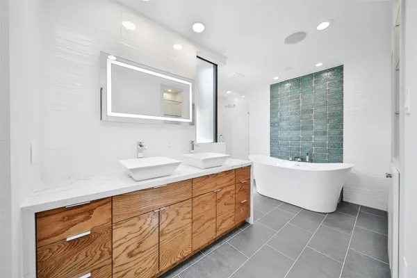 a white bath tub sitting in a bathroom