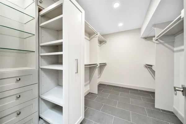 a view of staircase with white walls and a window
