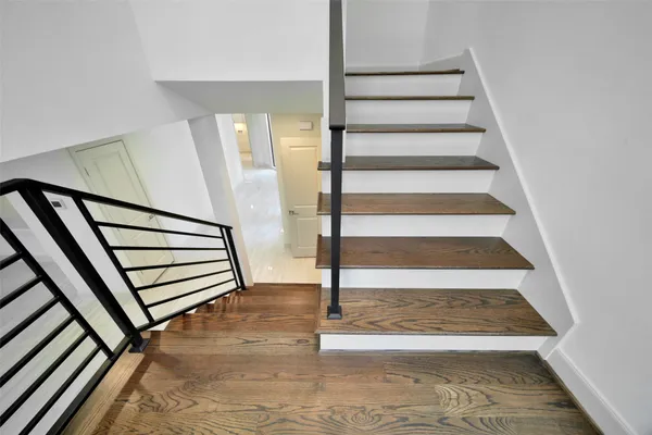 a bathroom with a granite countertop sink mirror and toilet
