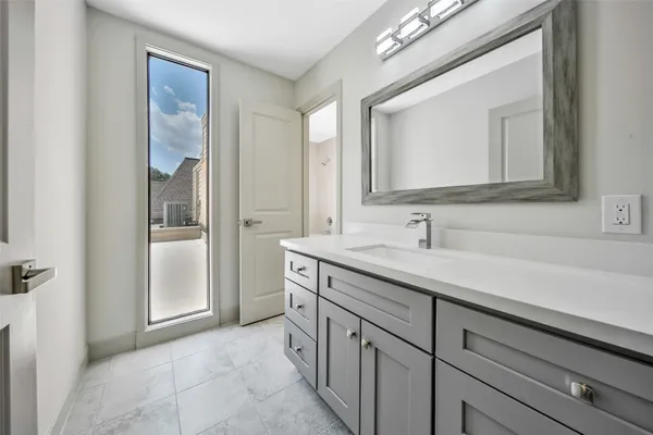 a white bath tub sitting next to a toilet