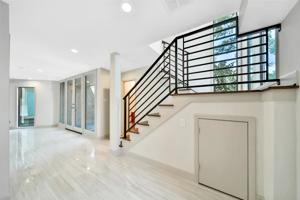 a view of a hallway with staircase