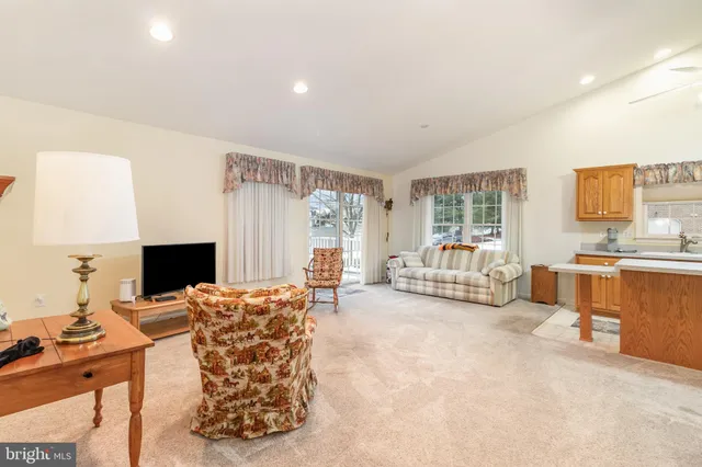 a view of a livingroom with furniture and a flat screen tv