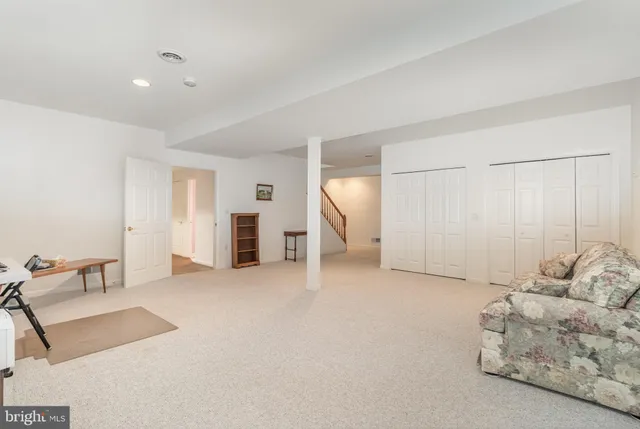 a bedroom with two beds and a chandelier