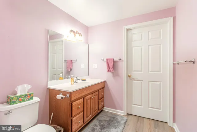 a bedroom with a bed and a bathroom