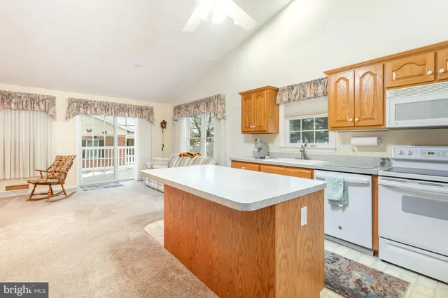 a kitchen with stainless steel appliances granite countertop a sink and cabinets