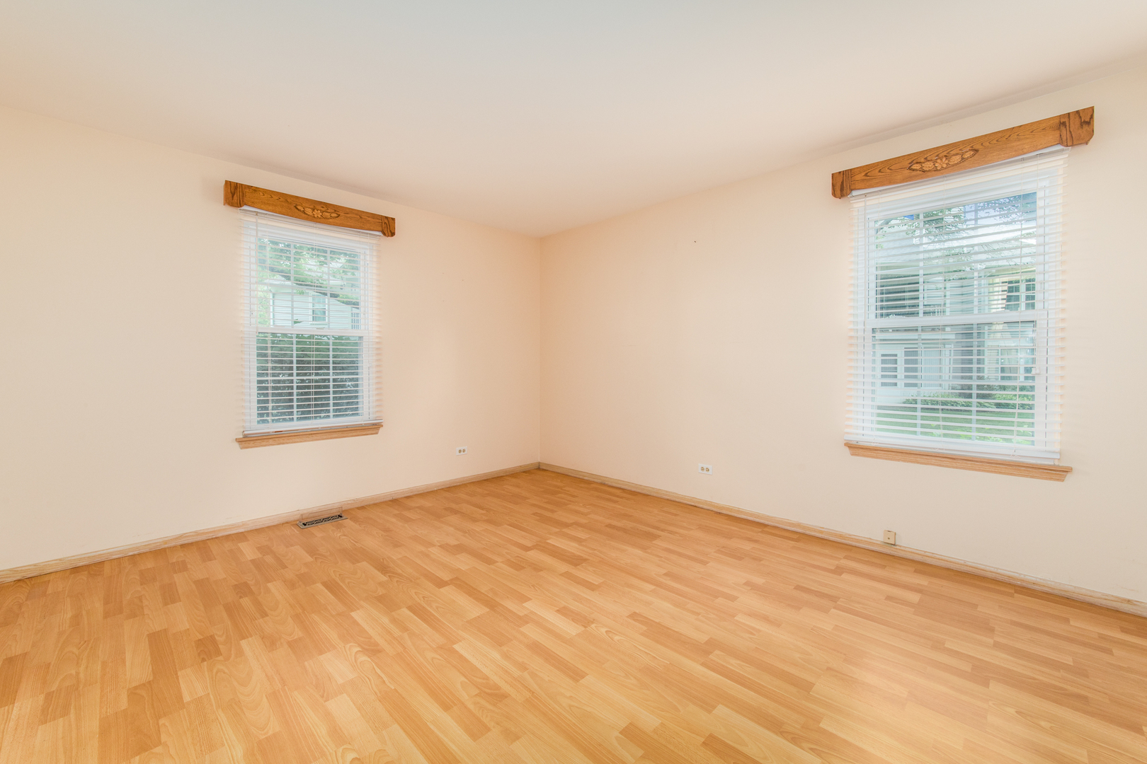 910 Persimmon Lane, Unit B Mount Prospect, IL 60056 - Photo 15 of 31 a view of an empty room with a window