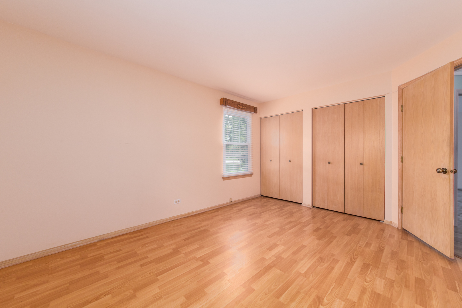 910 Persimmon Lane, Unit B Mount Prospect, IL 60056 - Photo 16 of 31 a view of an empty room and wooden floor