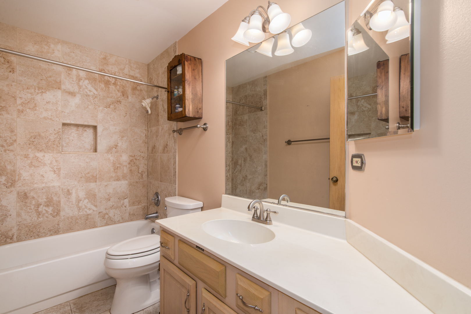 910 Persimmon Lane, Unit B Mount Prospect, IL 60056 - Photo 17 of 31 a bathroom with a sink a toilet and shower