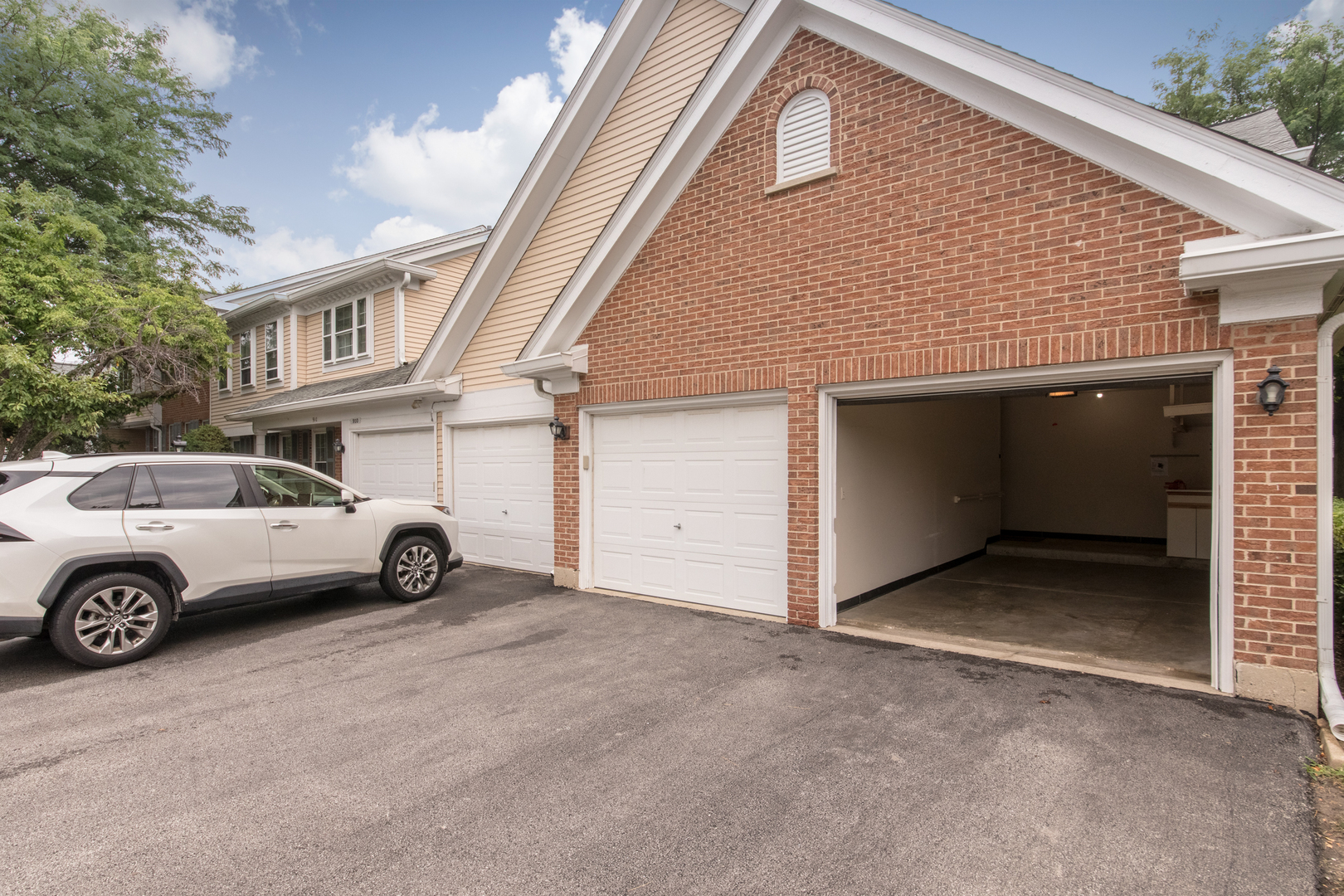 910 Persimmon Lane, Unit B Mount Prospect, IL 60056 - Photo 23 of 31 a view of a car in front of a house