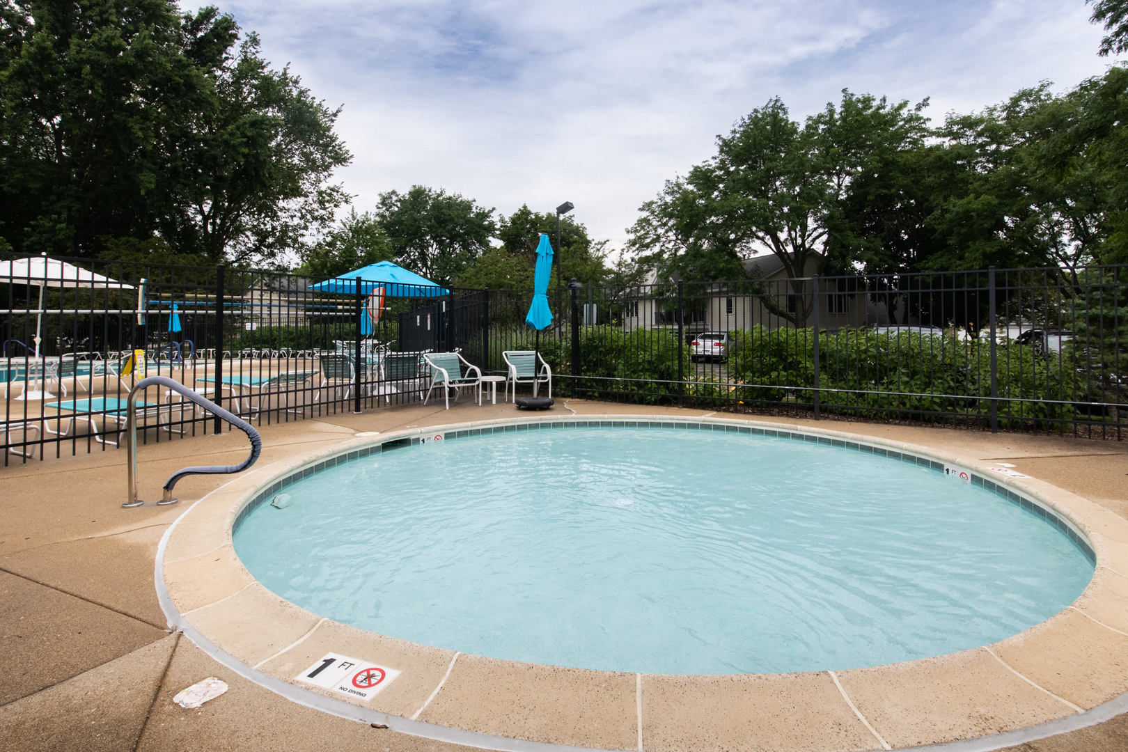 910 Persimmon Lane, Unit B Mount Prospect, IL 60056 - Photo 30 of 31 a view of a swimming pool with a patio
