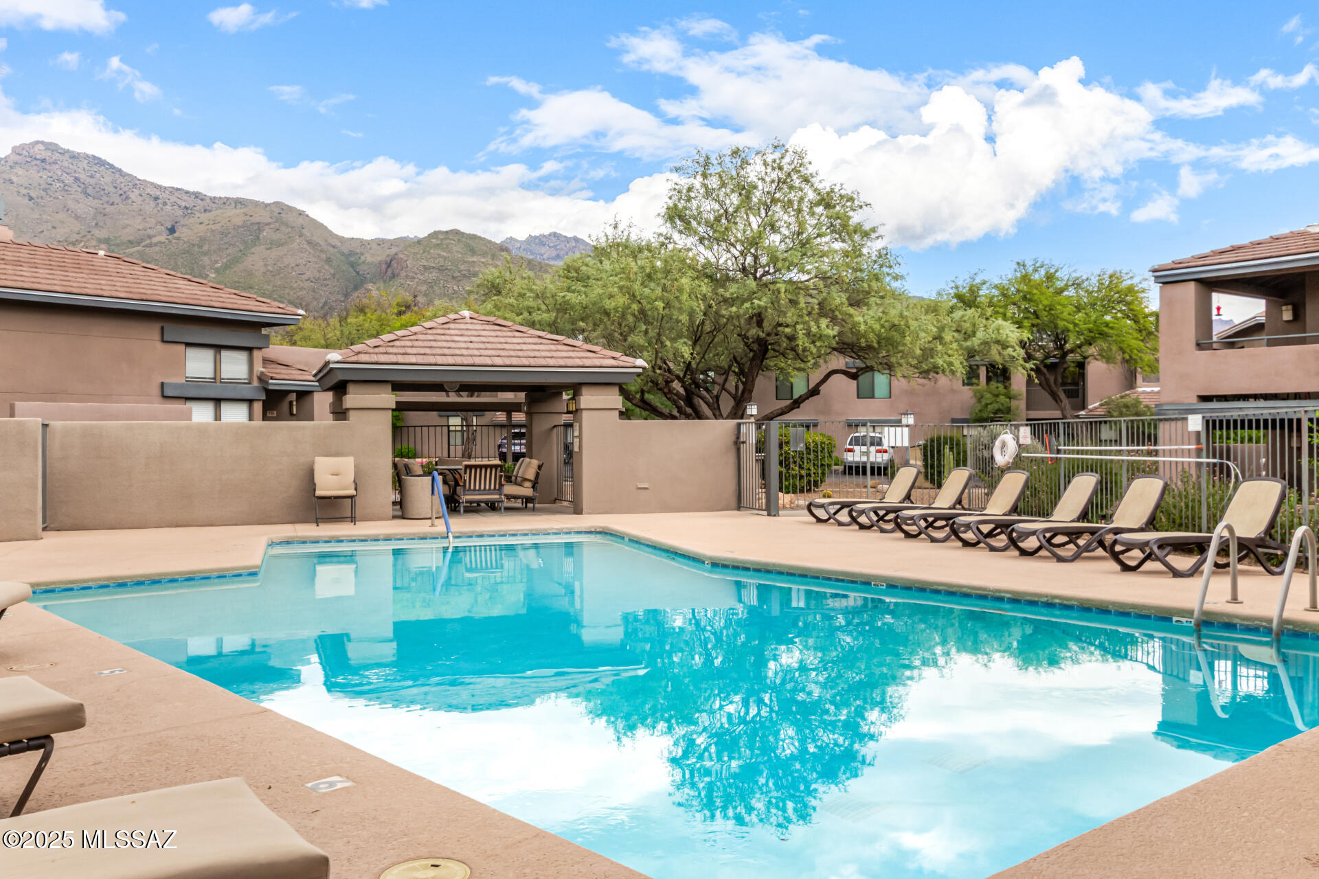 5855 North Kolb Road, Unit 8102 Tucson, AZ 85750 - Photo 2 of 28 a view of a swimming pool with lounge chair