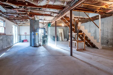a view of empty room with wooden walls
