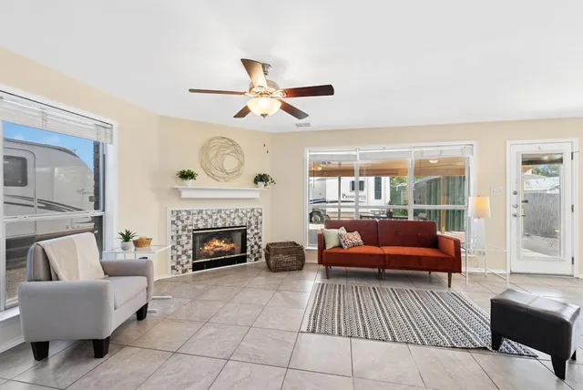 a living room with furniture and a fireplace