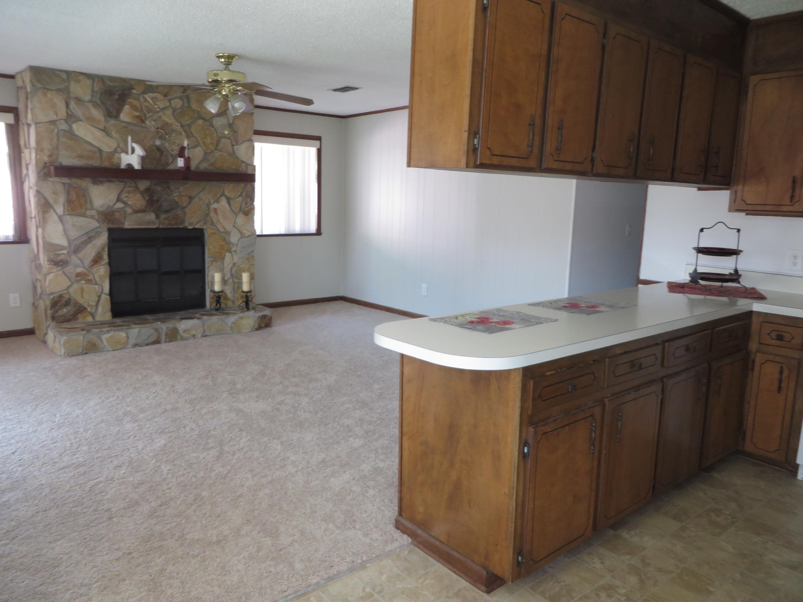 135 Perdido Circle Niceville, FL 32578 - Photo 11 of 28 a kitchen with a cabinets and fireplace