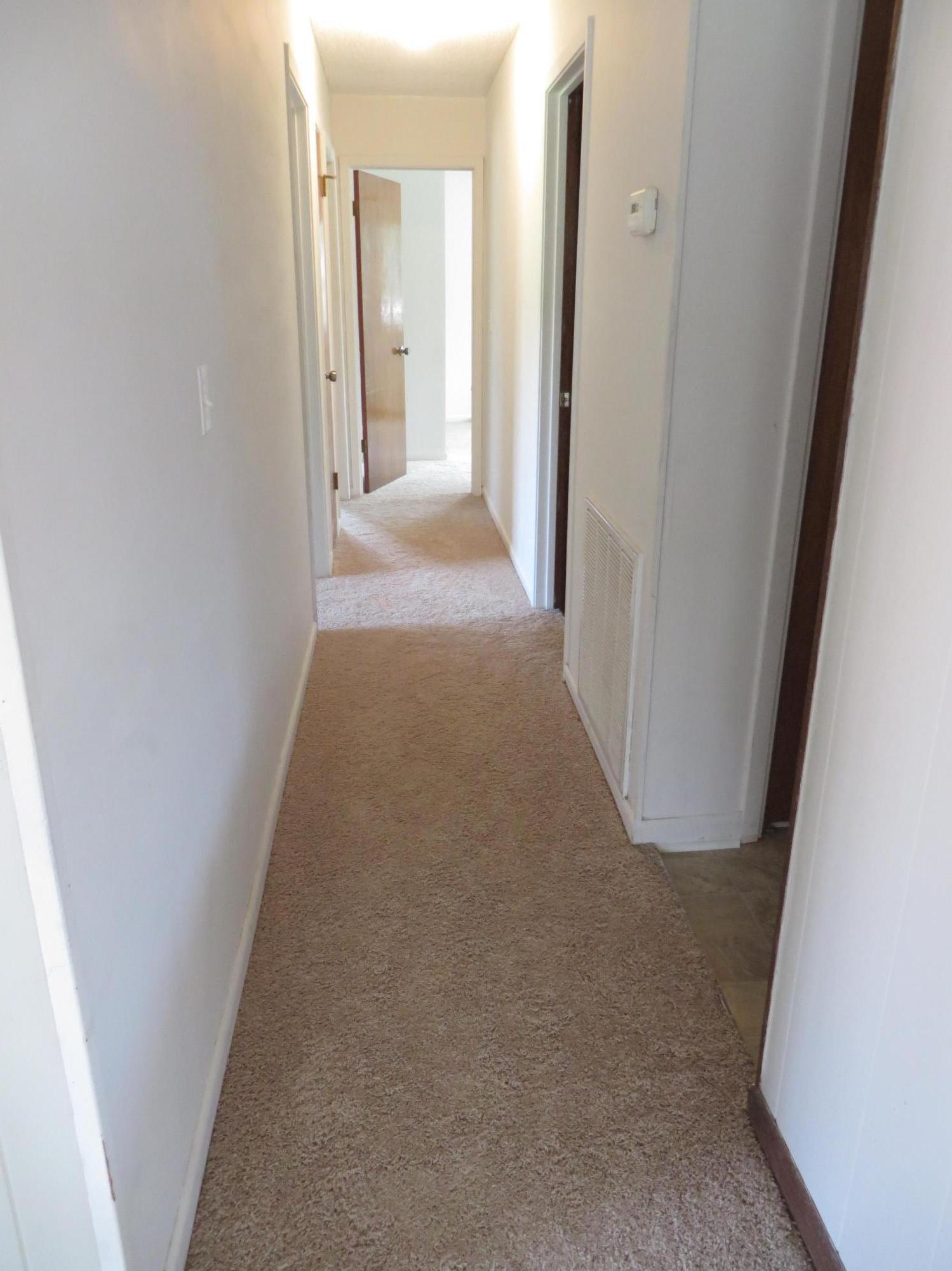 135 Perdido Circle Niceville, FL 32578 - Photo 14 of 28 a view of a hallway with wooden floor