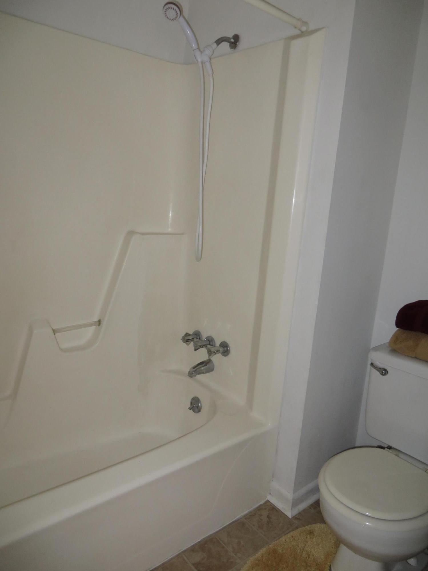 135 Perdido Circle Niceville, FL 32578 - Photo 20 of 28 a white toilet sitting next to a bath tub