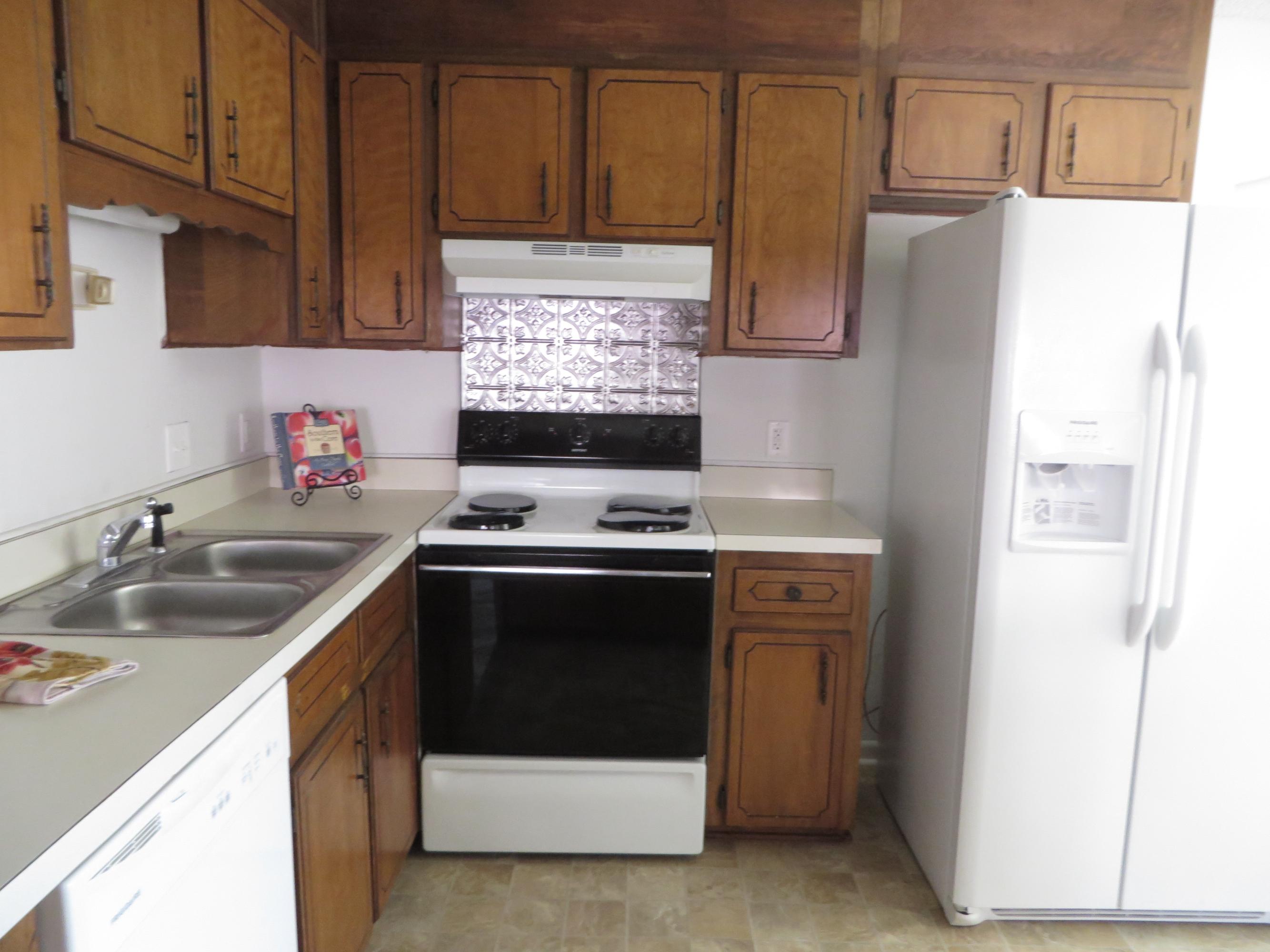 135 Perdido Circle Niceville, FL 32578 - Photo 8 of 28 a kitchen with stainless steel appliances granite countertop a sink stove and refrigerator