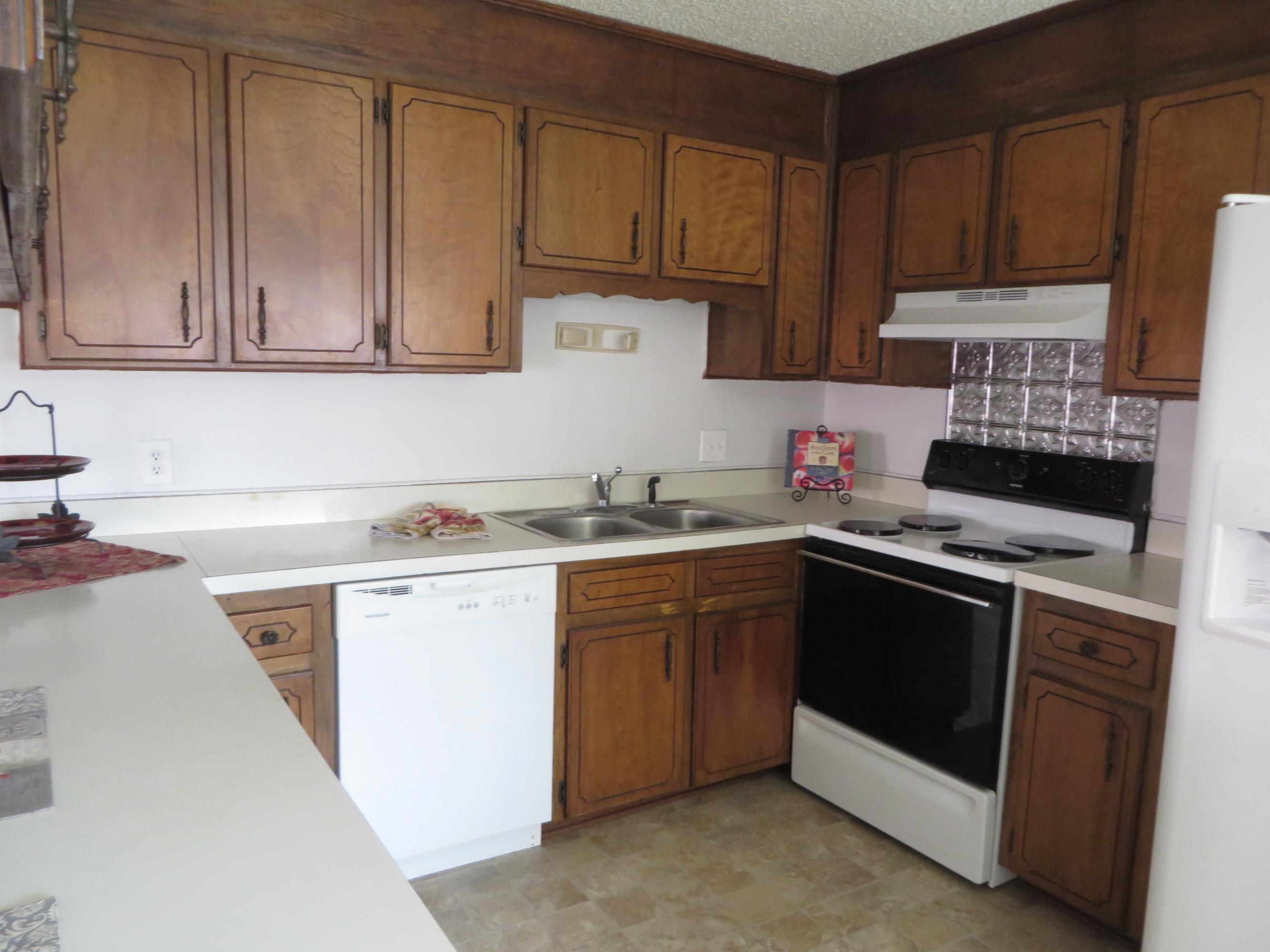 135 Perdido Circle Niceville, FL 32578 - Photo 10 of 28 a kitchen with stainless steel appliances granite countertop a sink stove and cabinets