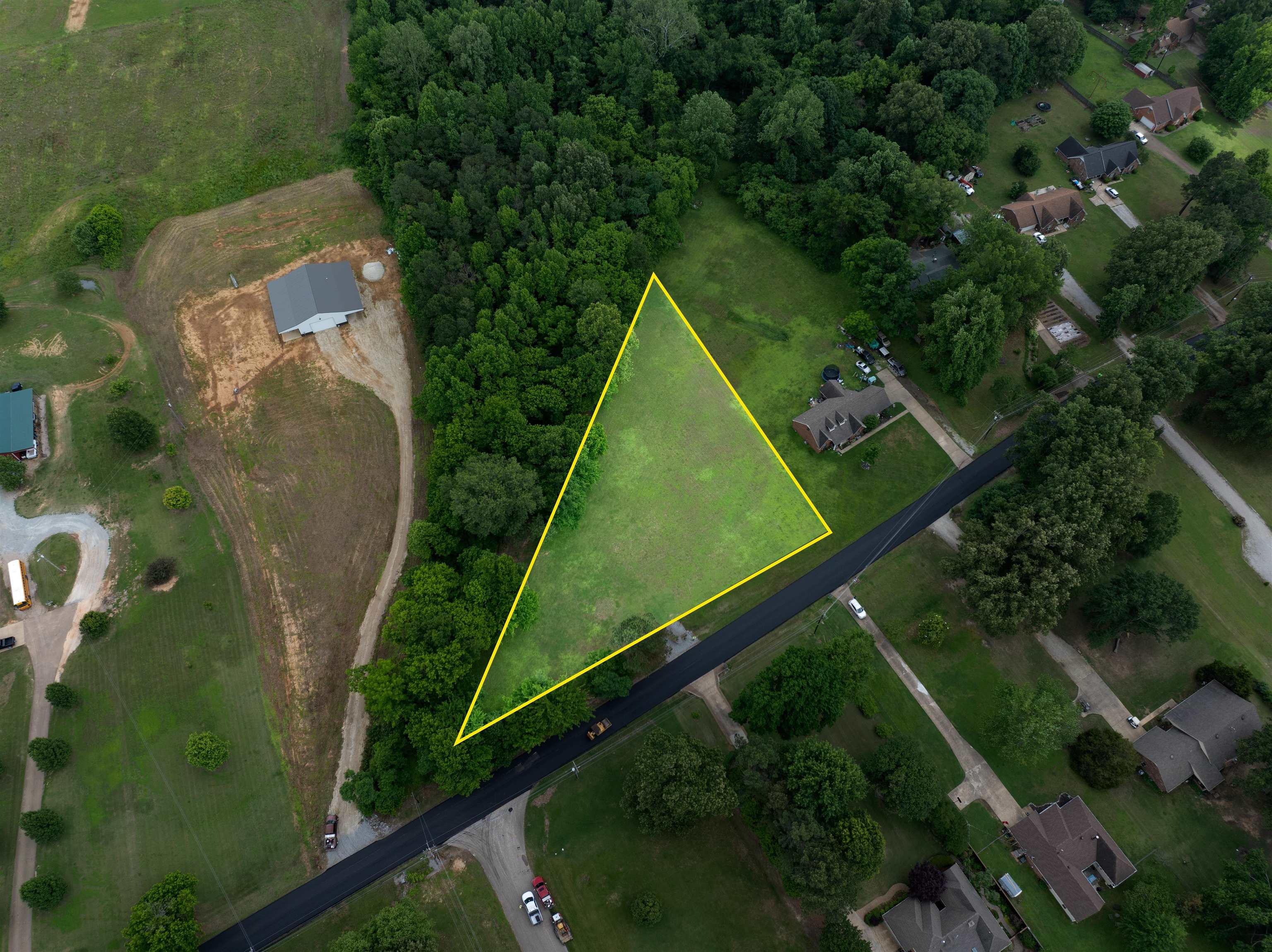0 Mcquiston Road Brighton, TN 38011 - Photo 2 of 7 an aerial view of a residential houses with outdoor space and street view