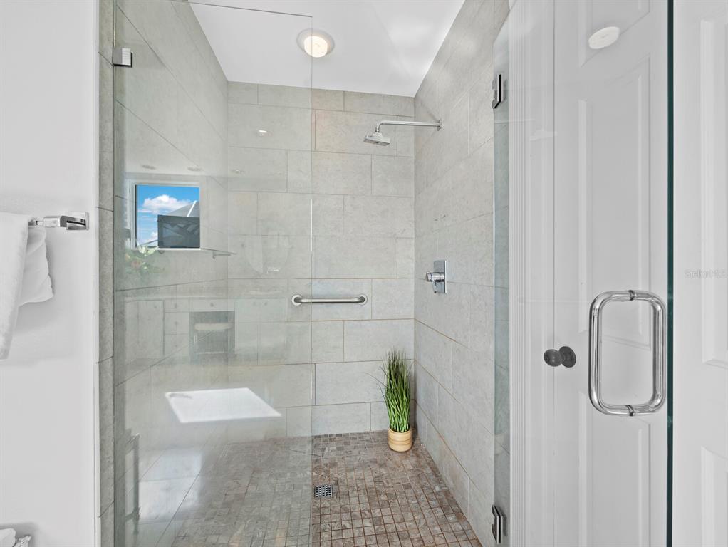 3543 Mistletoe Lane Longboat Key, FL 34228 - Photo 18 of 55 a bathroom with a shower