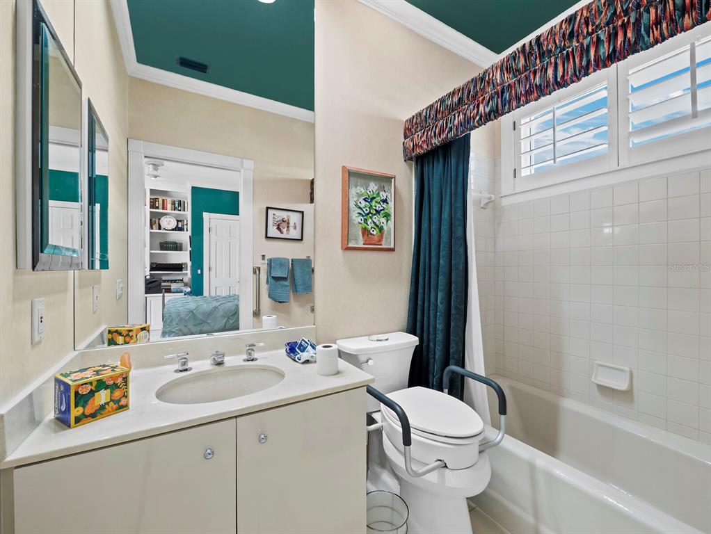 3543 Mistletoe Lane Longboat Key, FL 34228 - Photo 20 of 55 a bathroom with a sink a toilet and shower