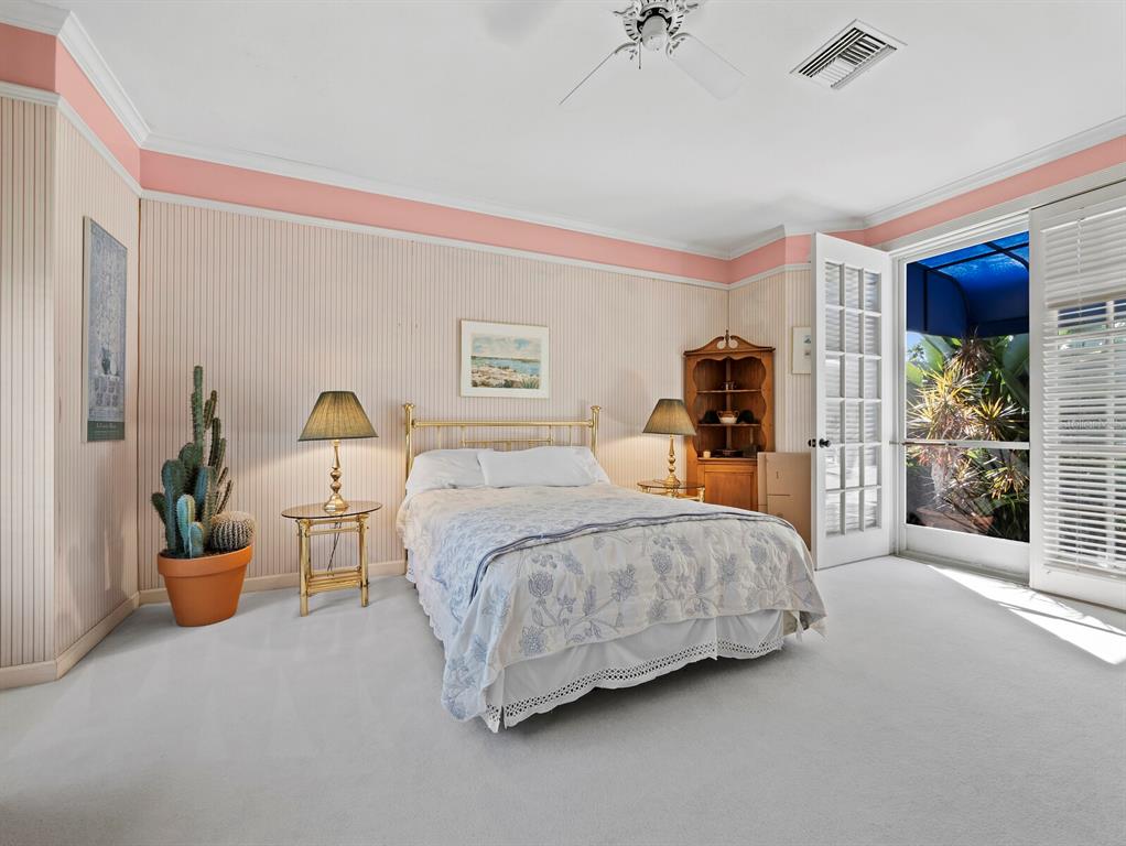 3543 Mistletoe Lane Longboat Key, FL 34228 - Photo 22 of 55 a bedroom with bed and window