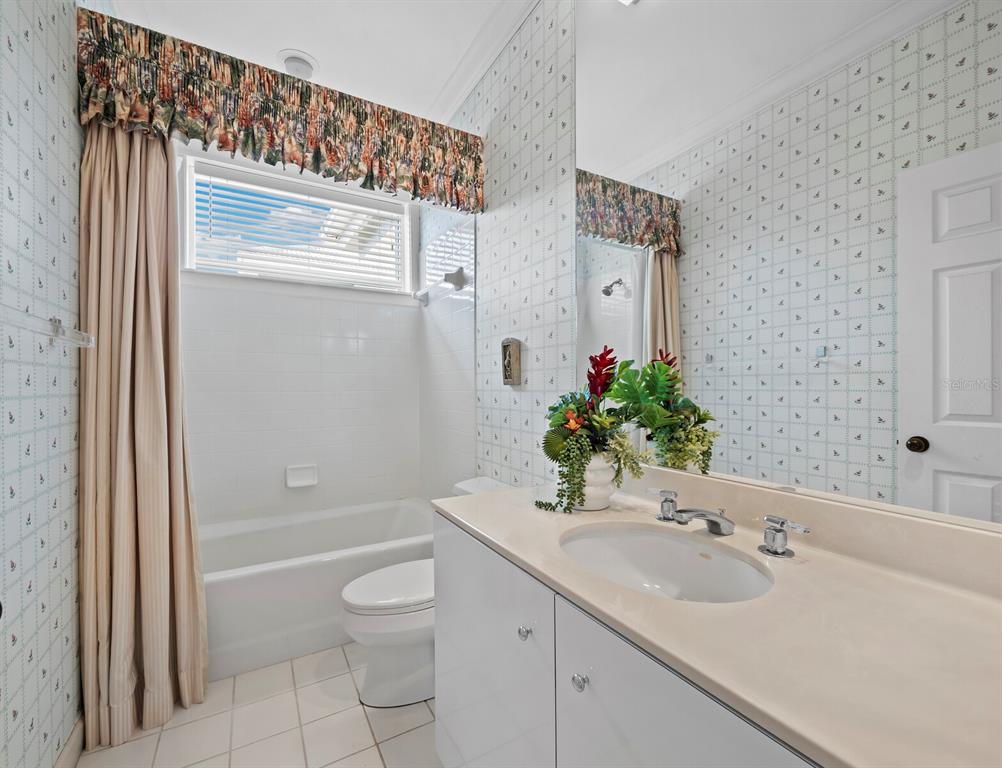 3543 Mistletoe Lane Longboat Key, FL 34228 - Photo 23 of 55 a bathroom with a sink toilet and shower