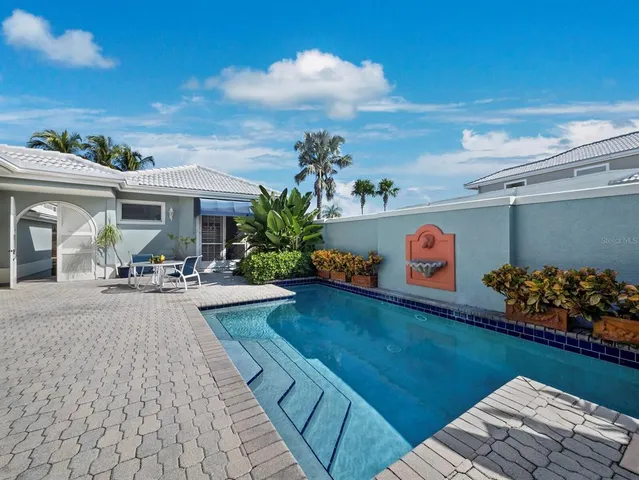 a view of a chairs and table in a backyard