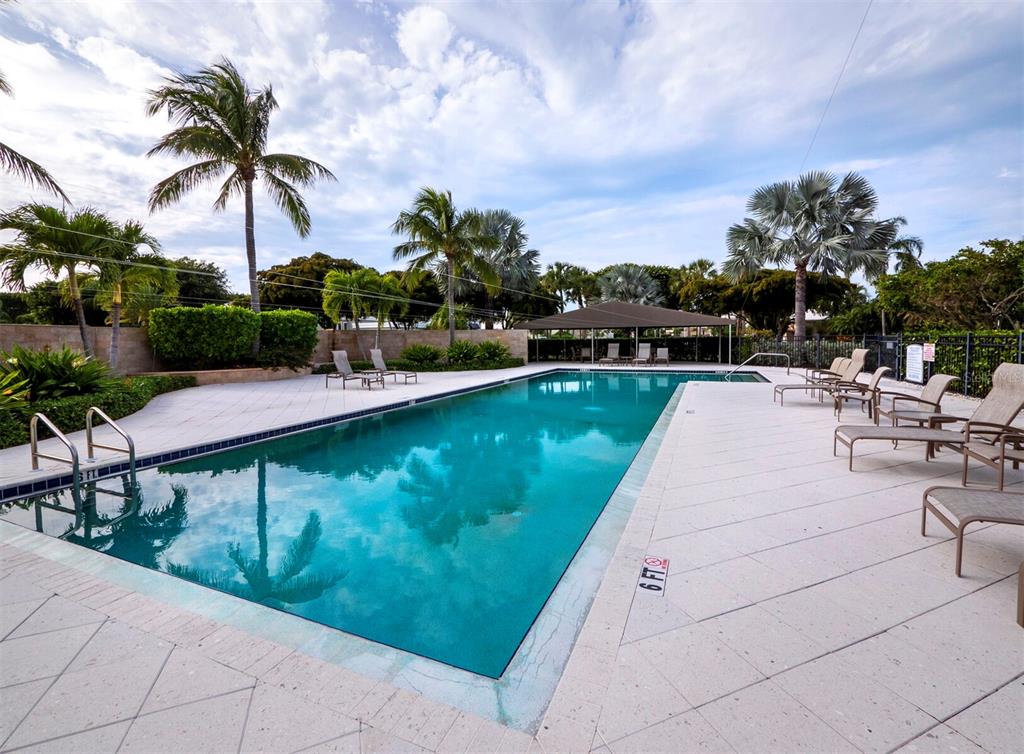 3543 Mistletoe Lane Longboat Key, FL 34228 - Photo 32 of 55 a view of swimming pool with outdoor seating and plants