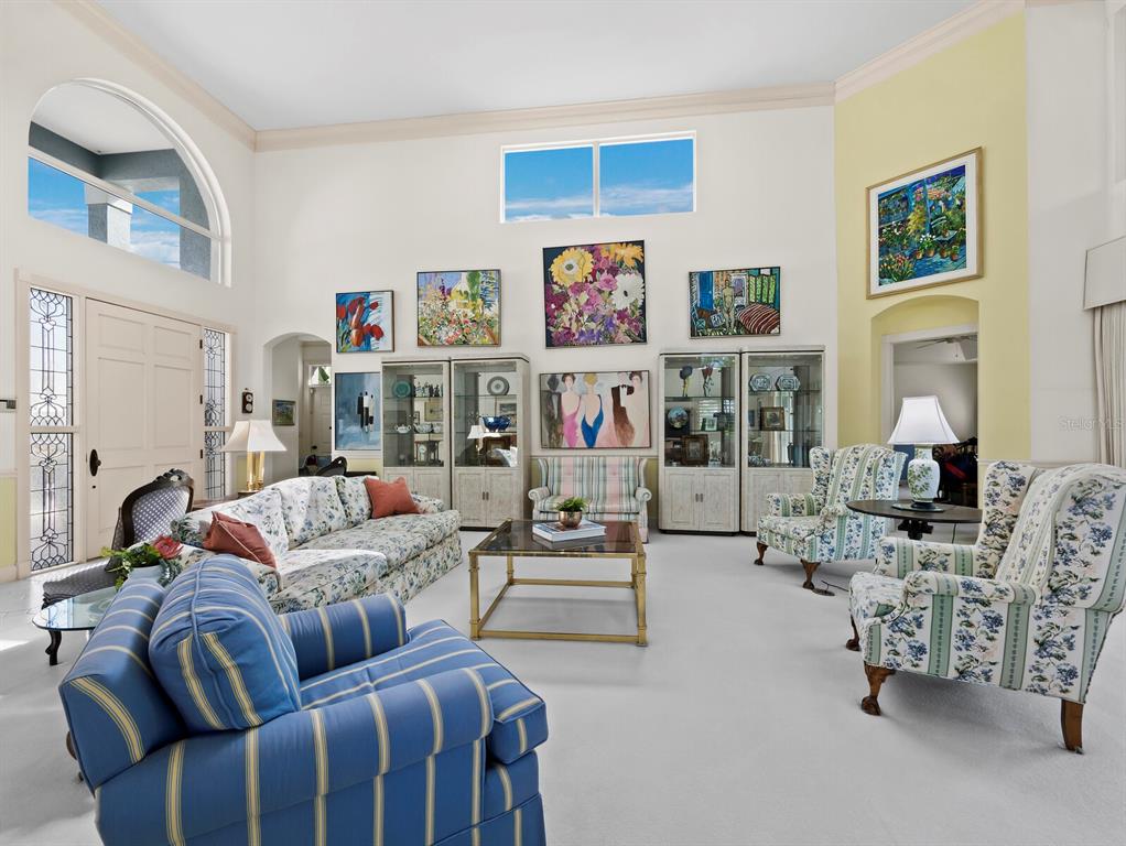 3543 Mistletoe Lane Longboat Key, FL 34228 - Photo 7 of 55 a living room with furniture and a fireplace