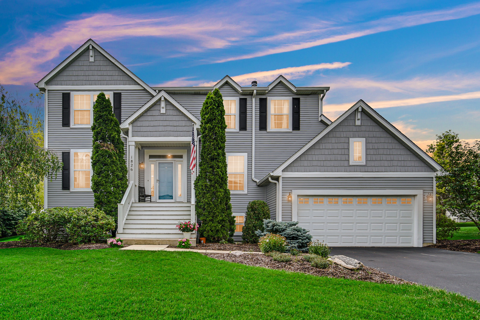 1826 Prairie Ridge Circle Lindenhurst, IL 60046 - Photo 1 of 39 a front view of a house with a garden and yard