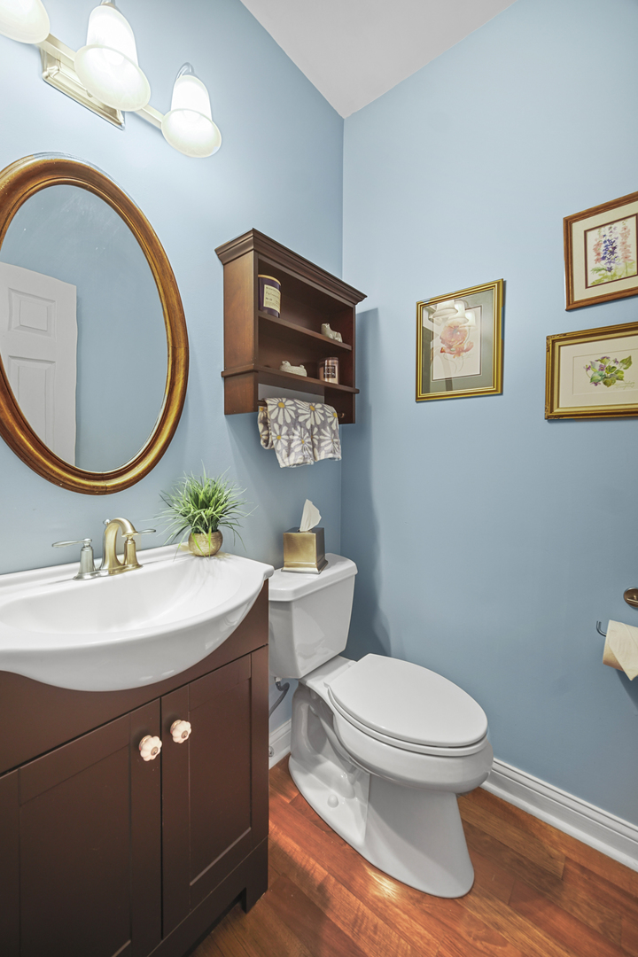 1826 Prairie Ridge Circle Lindenhurst, IL 60046 - Photo 11 of 39 a bathroom with a toilet a sink and mirror