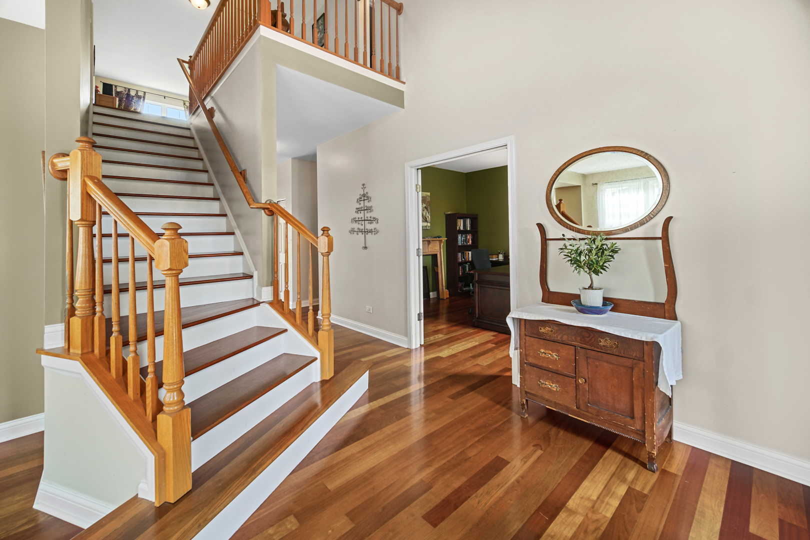 1826 Prairie Ridge Circle Lindenhurst, IL 60046 - Photo 2 of 39 a view of a hallway with wooden floor and staircase