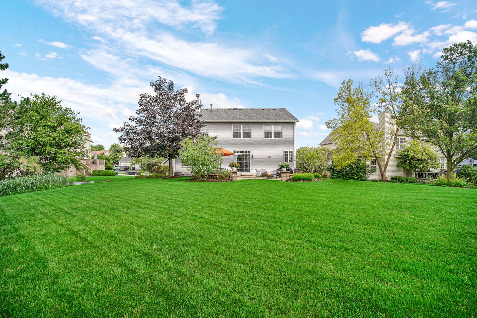 1826 Prairie Ridge Circle Lindenhurst, IL 60046 - Photo 32 of 39 a view of a house with a big yard and potted plants