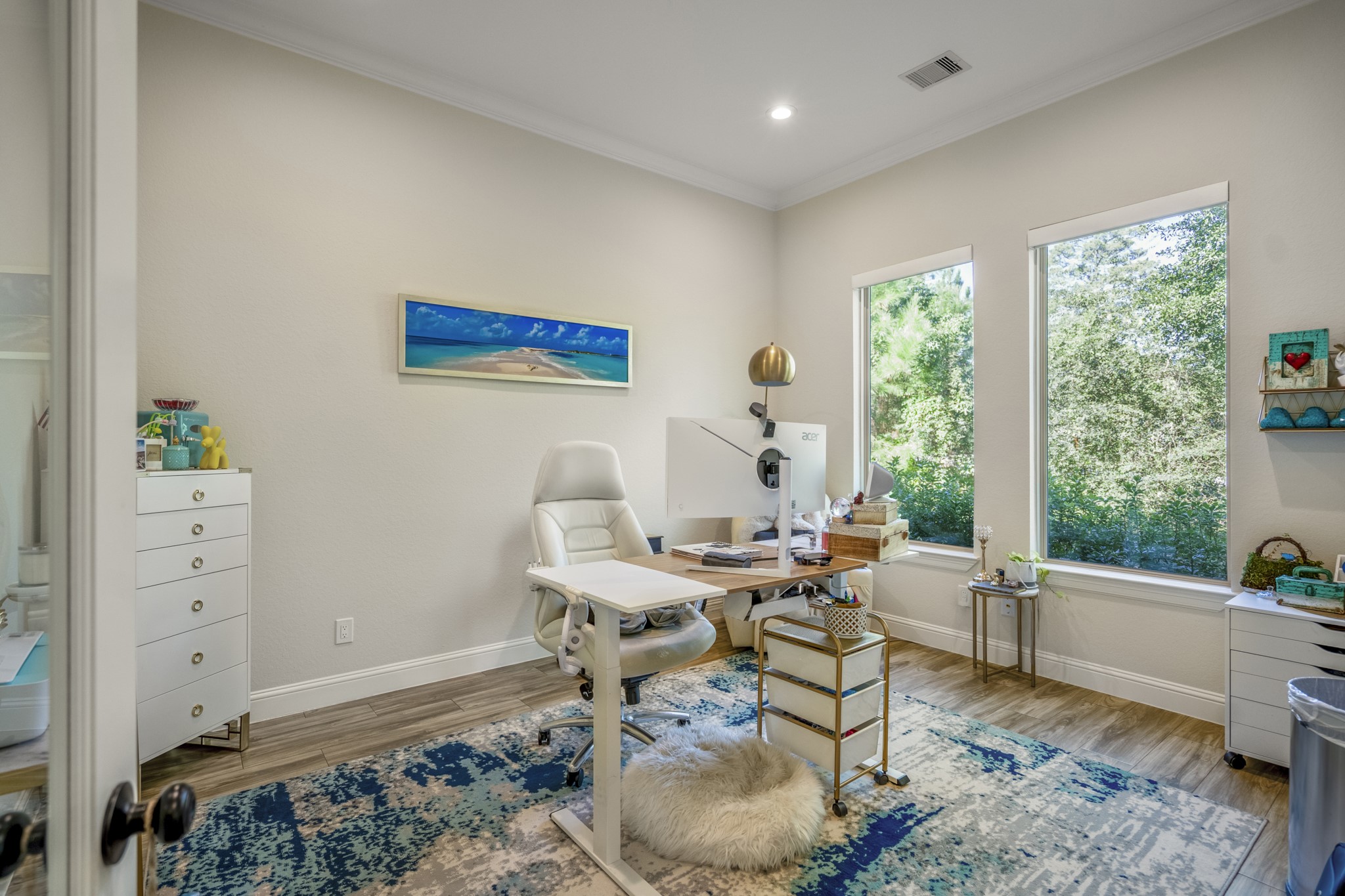 25202 Wilkes Park Road Tomball, TX 77375 - Photo 11 of 50 Private home office with large windows offers an inspiring workspace with natural light. There are also motorized blinds for convenience, privacy and light control.