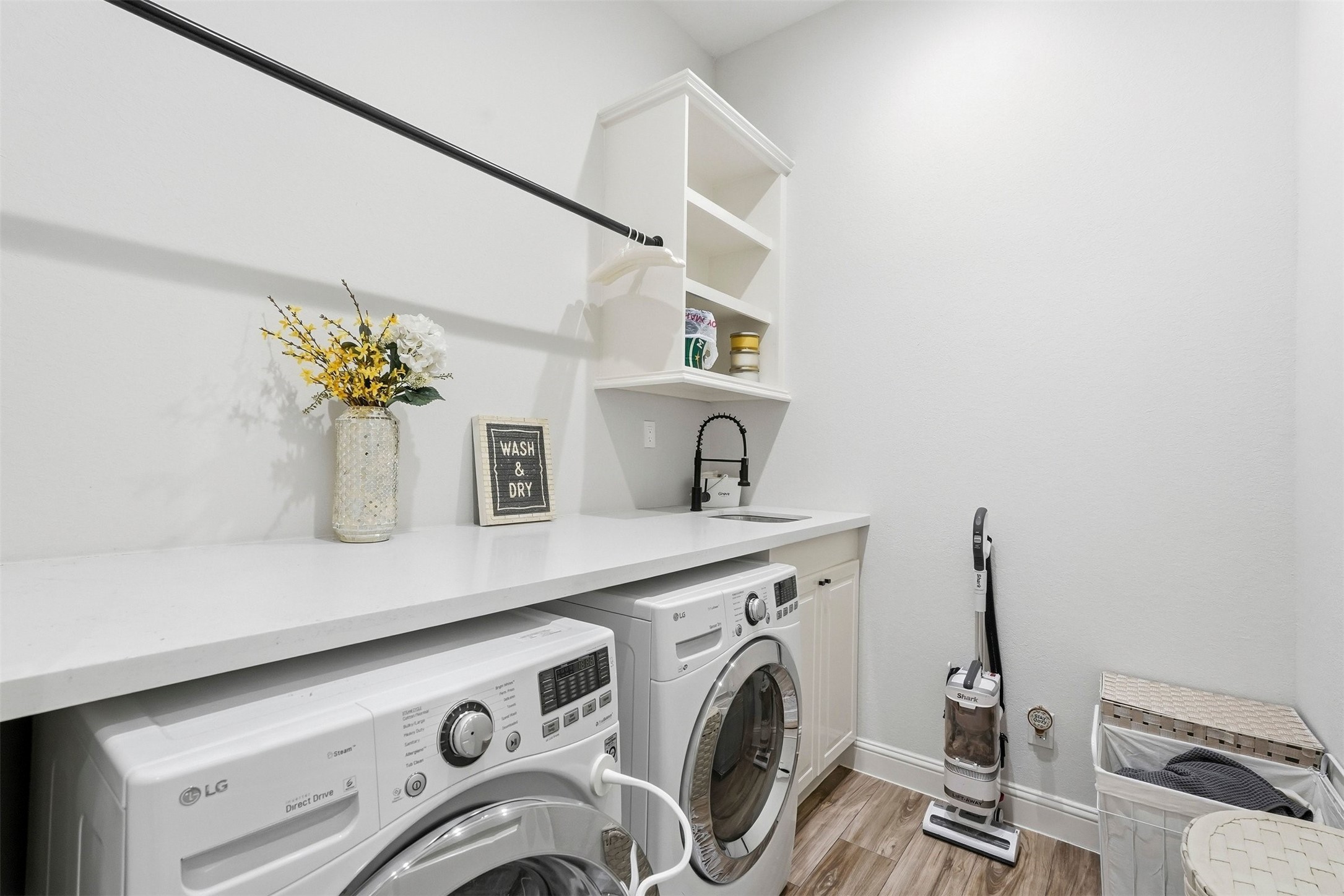 25202 Wilkes Park Road Tomball, TX 77375 - Photo 29 of 47 a view of storage and utility room with washer and dryer