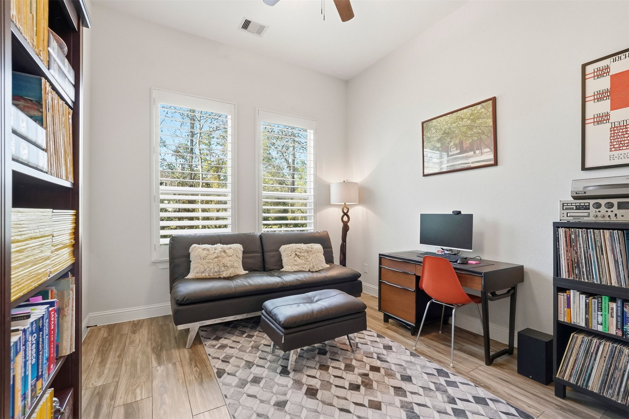 25202 Wilkes Park Road Tomball, TX 77375 - Photo 30 of 47 a living room with furniture and a book shelf