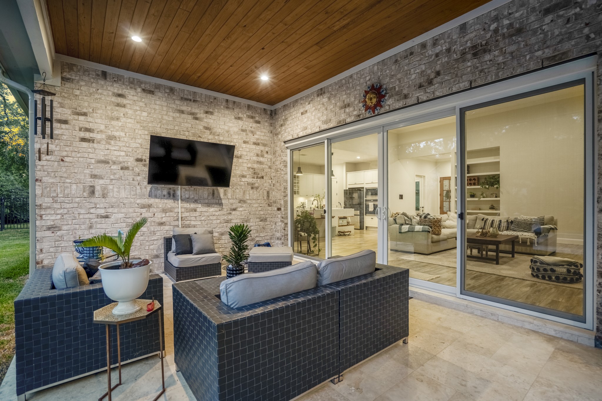 25202 Wilkes Park Road Tomball, TX 77375 - Photo 38 of 50 Extended patio space provides seamless indoor-outdoor living, ideal for morning coffee, evening relaxation and weekend hosting.