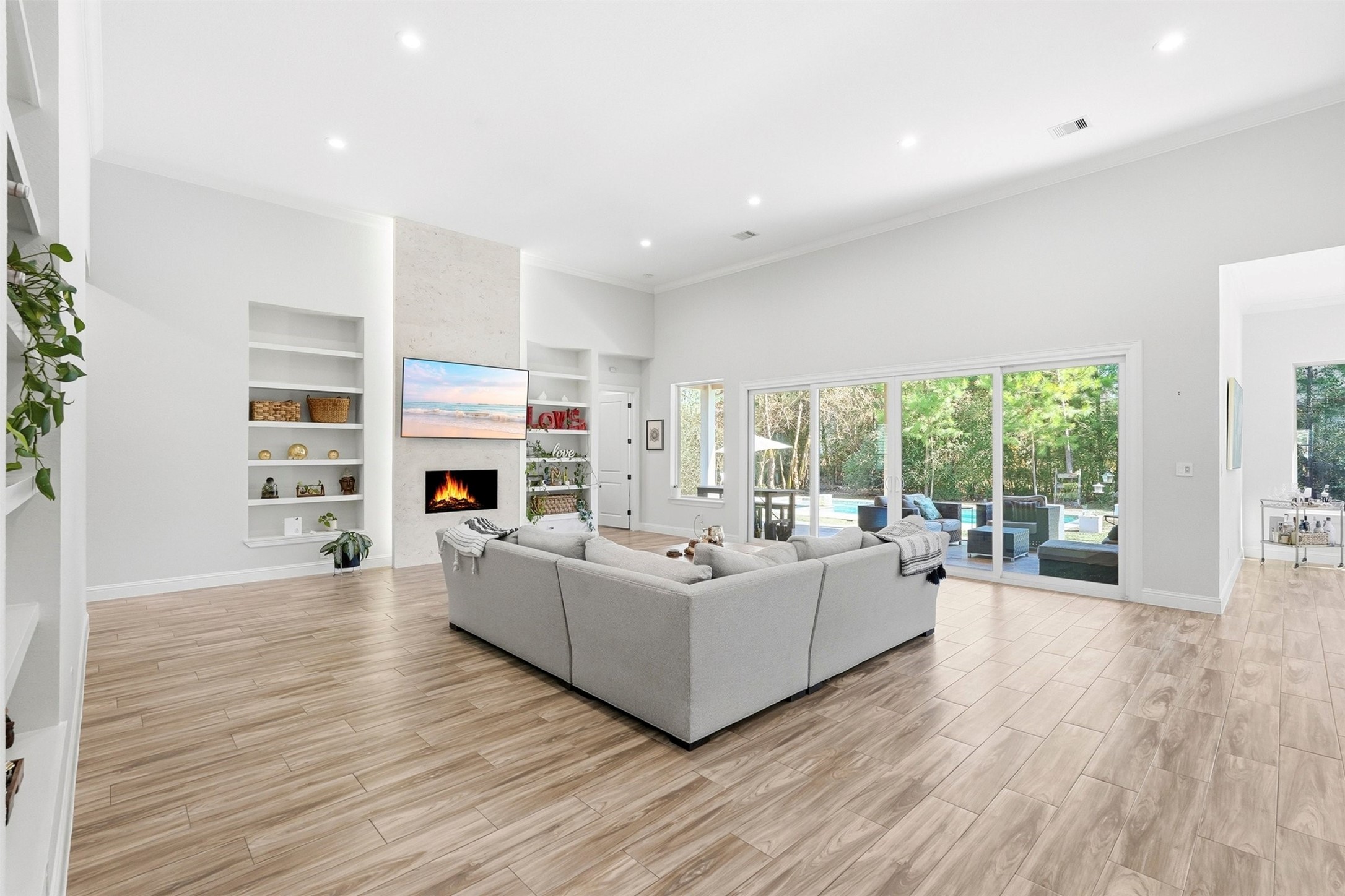 25202 Wilkes Park Road Tomball, TX 77375 - Photo 4 of 47 a living room with fireplace furniture and a large window