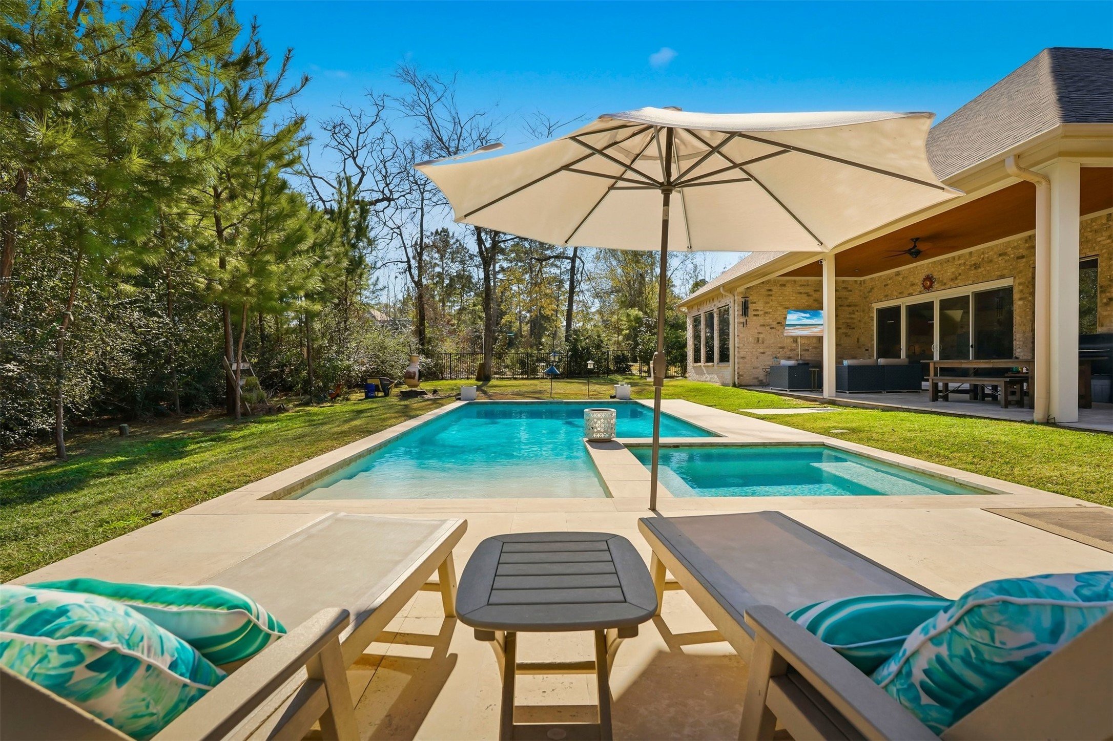25202 Wilkes Park Road Tomball, TX 77375 - Photo 42 of 47 a view of a backyard with a swimming pool and porch