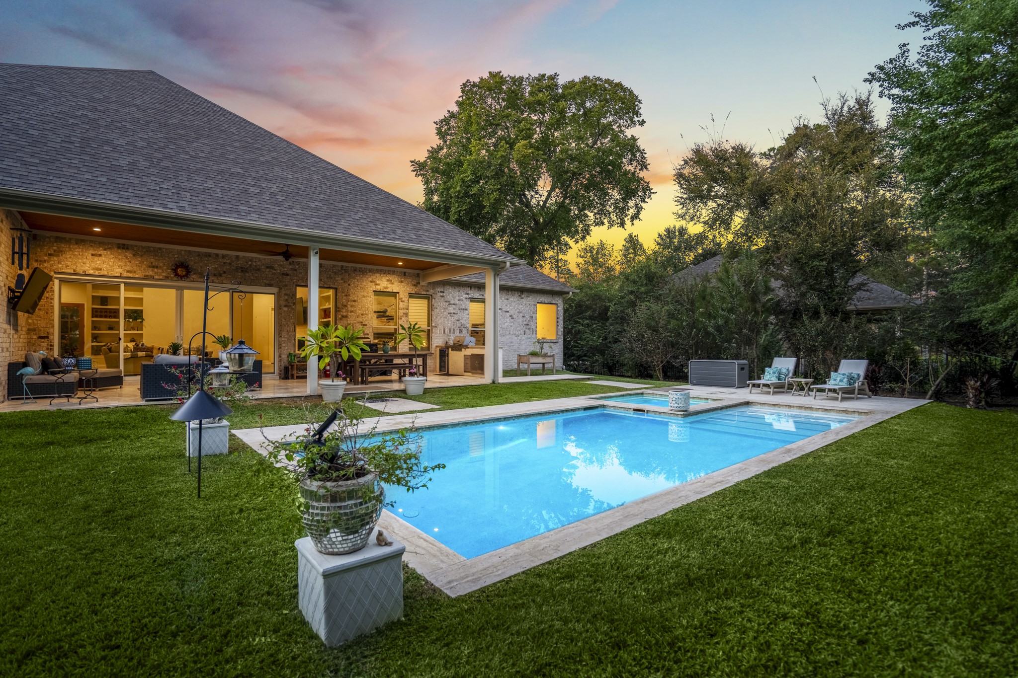 25202 Wilkes Park Road Tomball, TX 77375 - Photo 43 of 50 Enjoy year-round serenity with a heated spa and refreshing pool set against a backdrop of nature and quiet luxury.