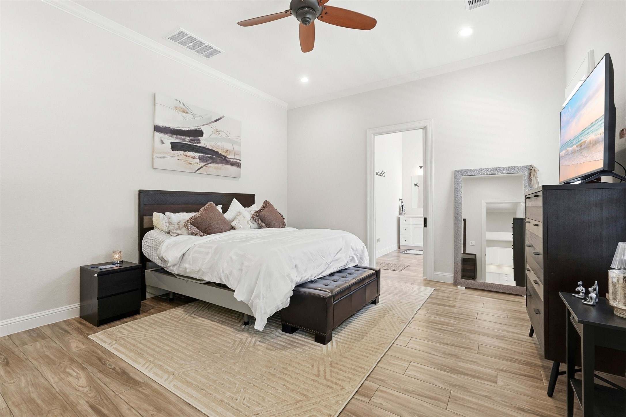 25202 Wilkes Park Road Tomball, TX 77375 - Photo 7 of 47 a bedroom with a bed dresser and a flat screen tv