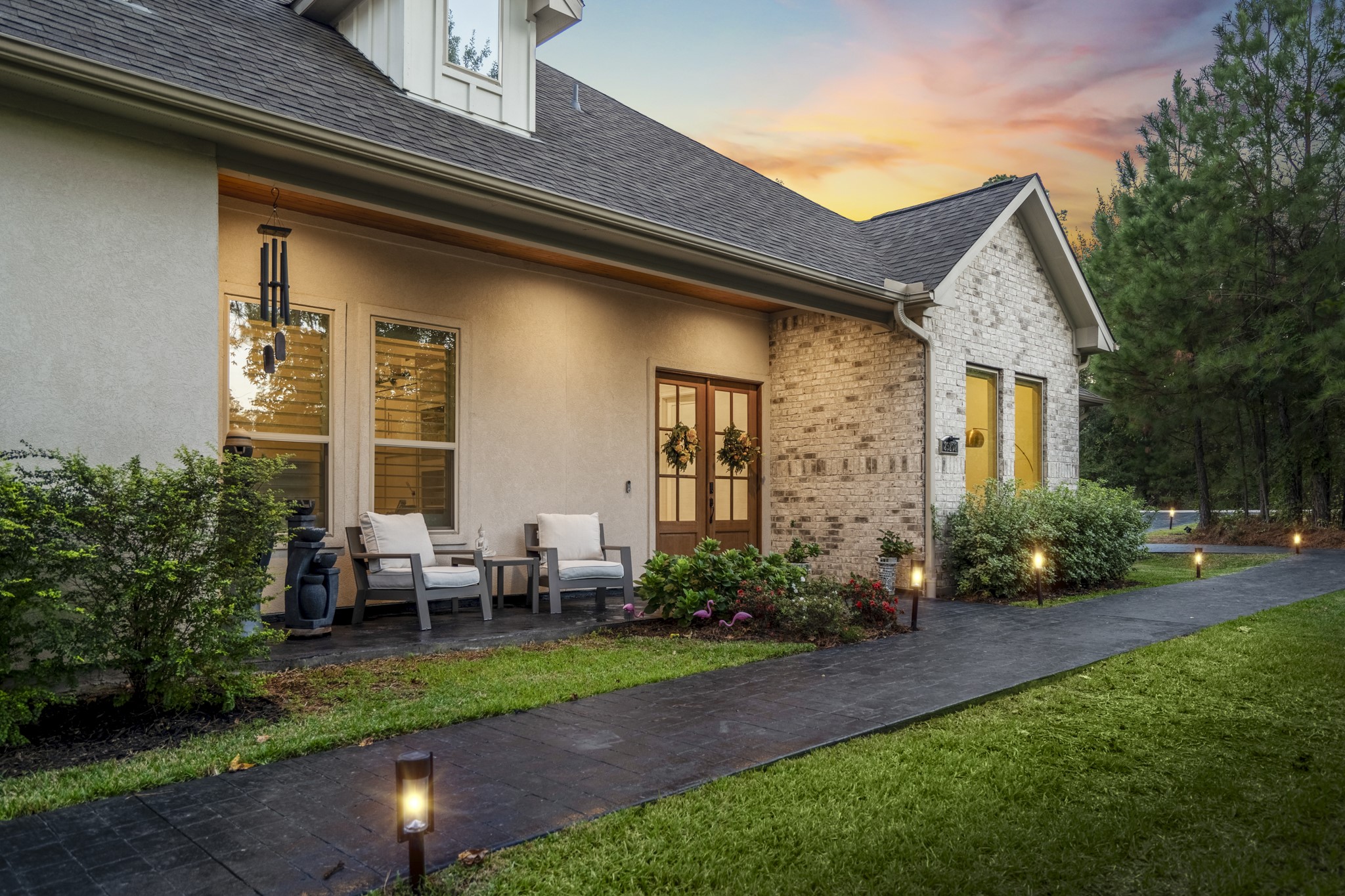 25202 Wilkes Park Road Tomball, TX 77375 - Photo 8 of 50 Gentle pathway lighting guides guests safely to the front door with an upscale resort ambience.