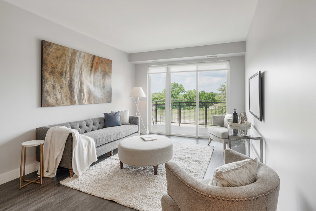 101 West Liberty Street, Unit 319 Barrington, IL 60010 - Photo 5 of 18 a living room with furniture and a large window