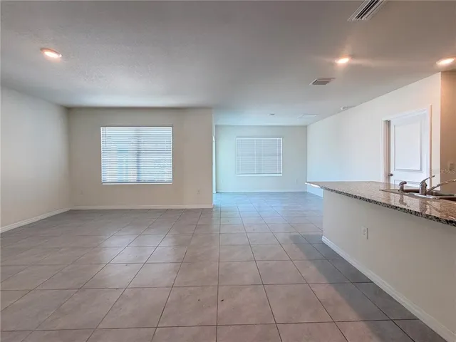 a view of a kitchen with a sink and a window