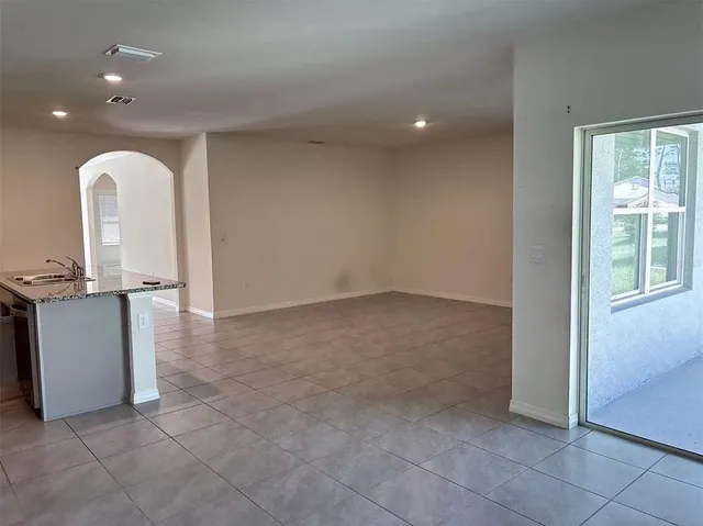 a view of an empty room and window