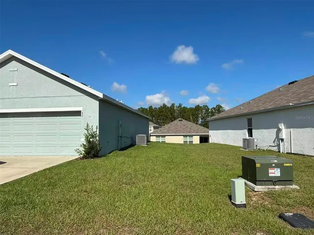 a house view with a play ground in front of it