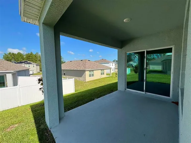 a view of a porch and garden