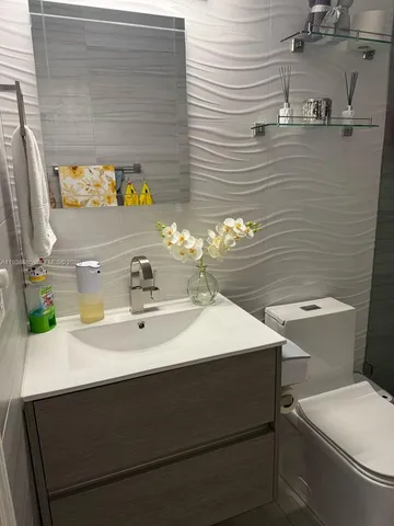 a bedroom with a bed and walk in closet