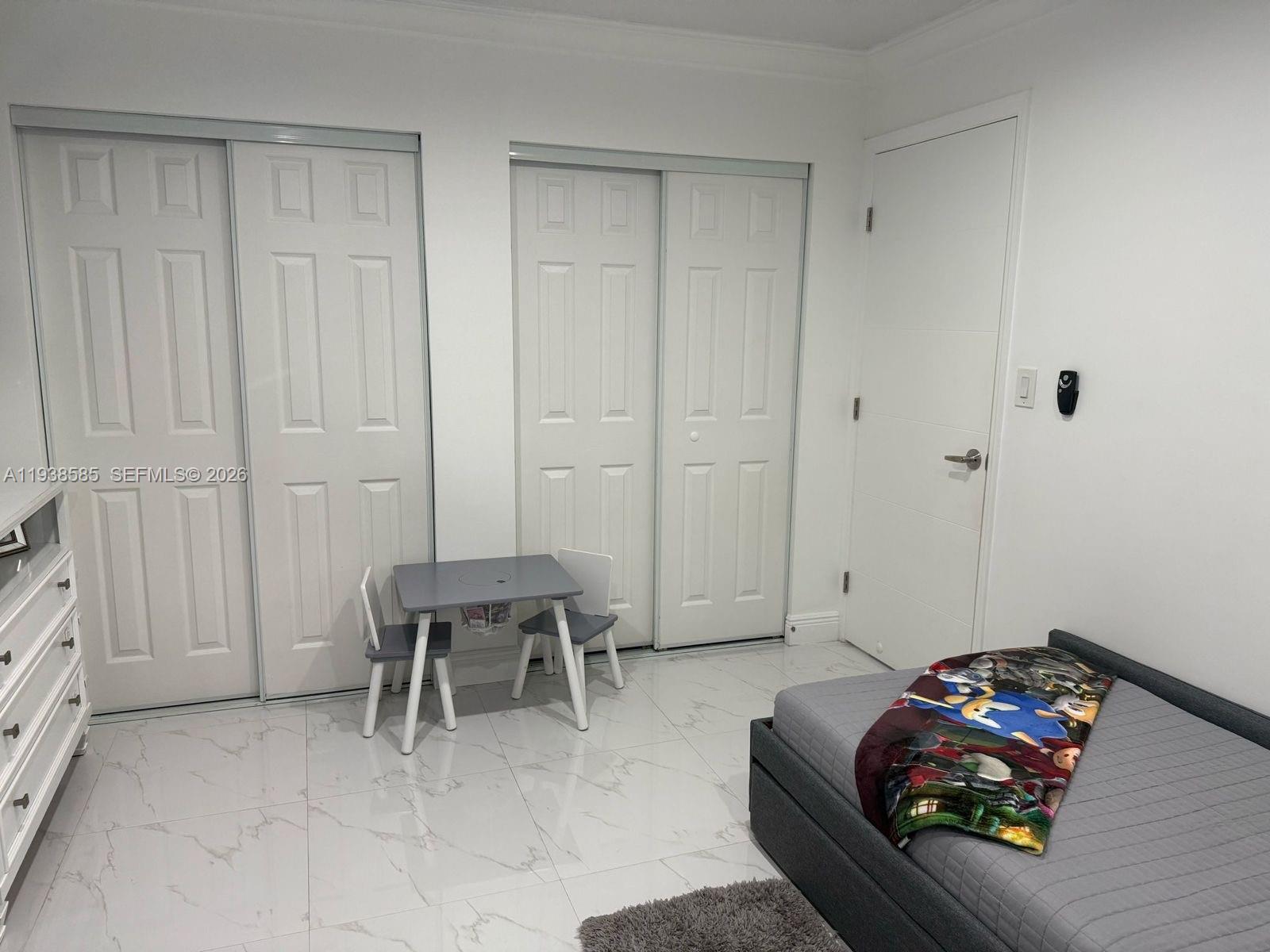 2837 West 75th Street Hialeah, FL 33018 - Photo 18 of 22 a livingroom with furniture and a couch